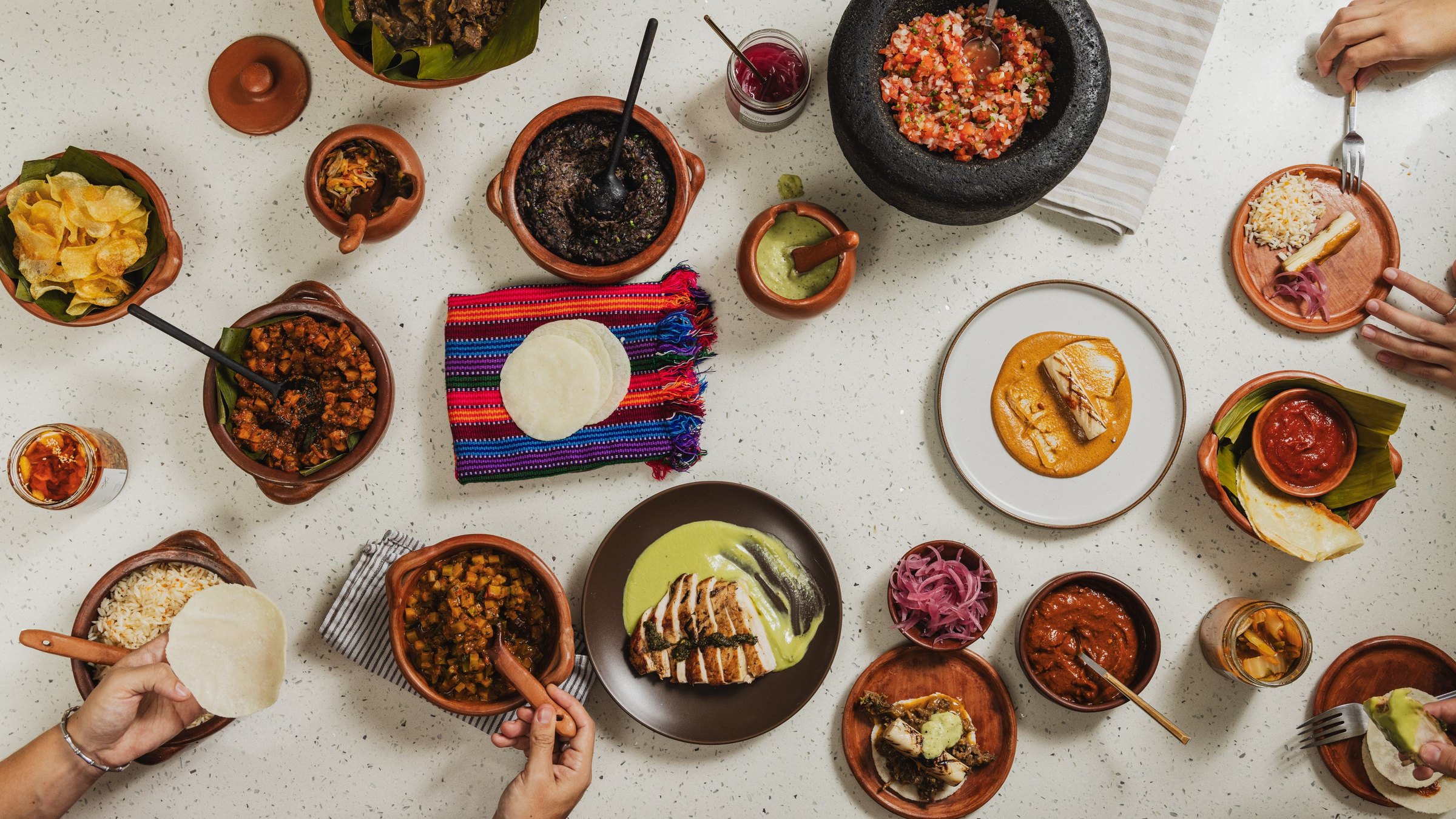 Family style costa rican feast passed around the table, guanacaste.